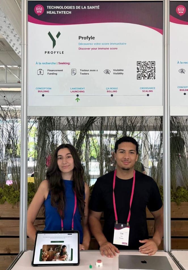 Two Profyle Immune team members at the Profyle booth in the HealthTech zone at Startupfest 2026