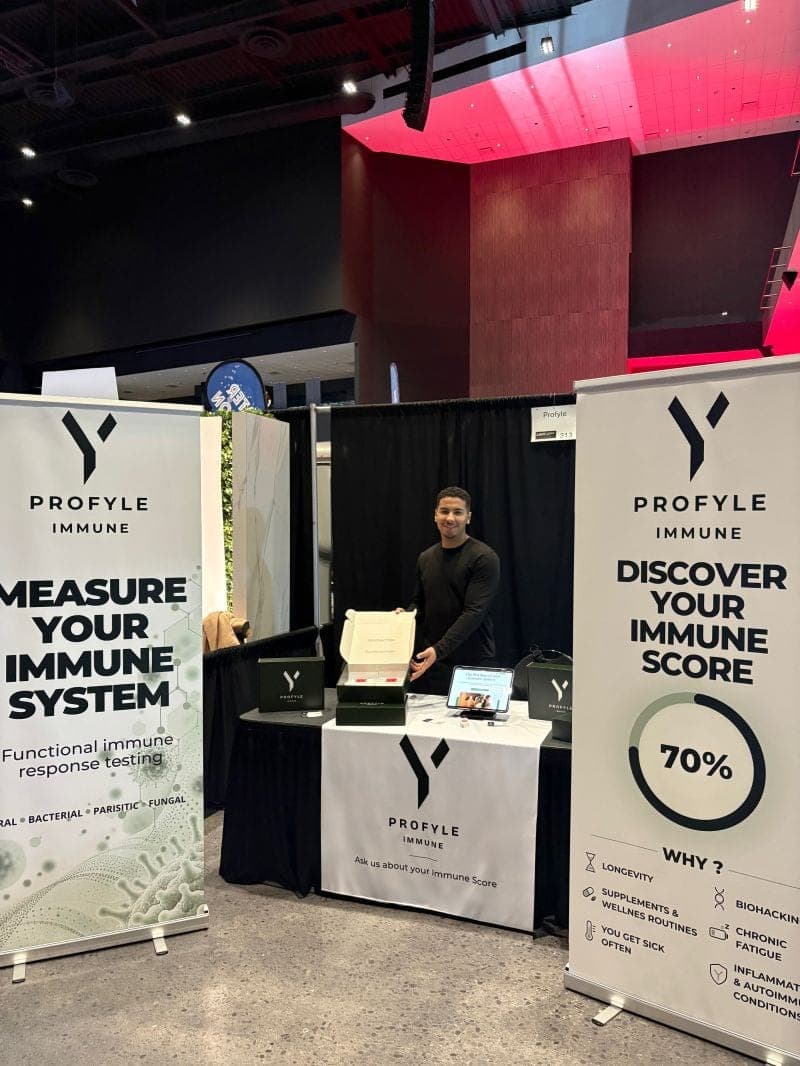 Profyle Immune booth 313 at the Canadian Longevity and Wellness Expo in Toronto, with banners reading “Measure your immune system” and “Discover your Immune Score”