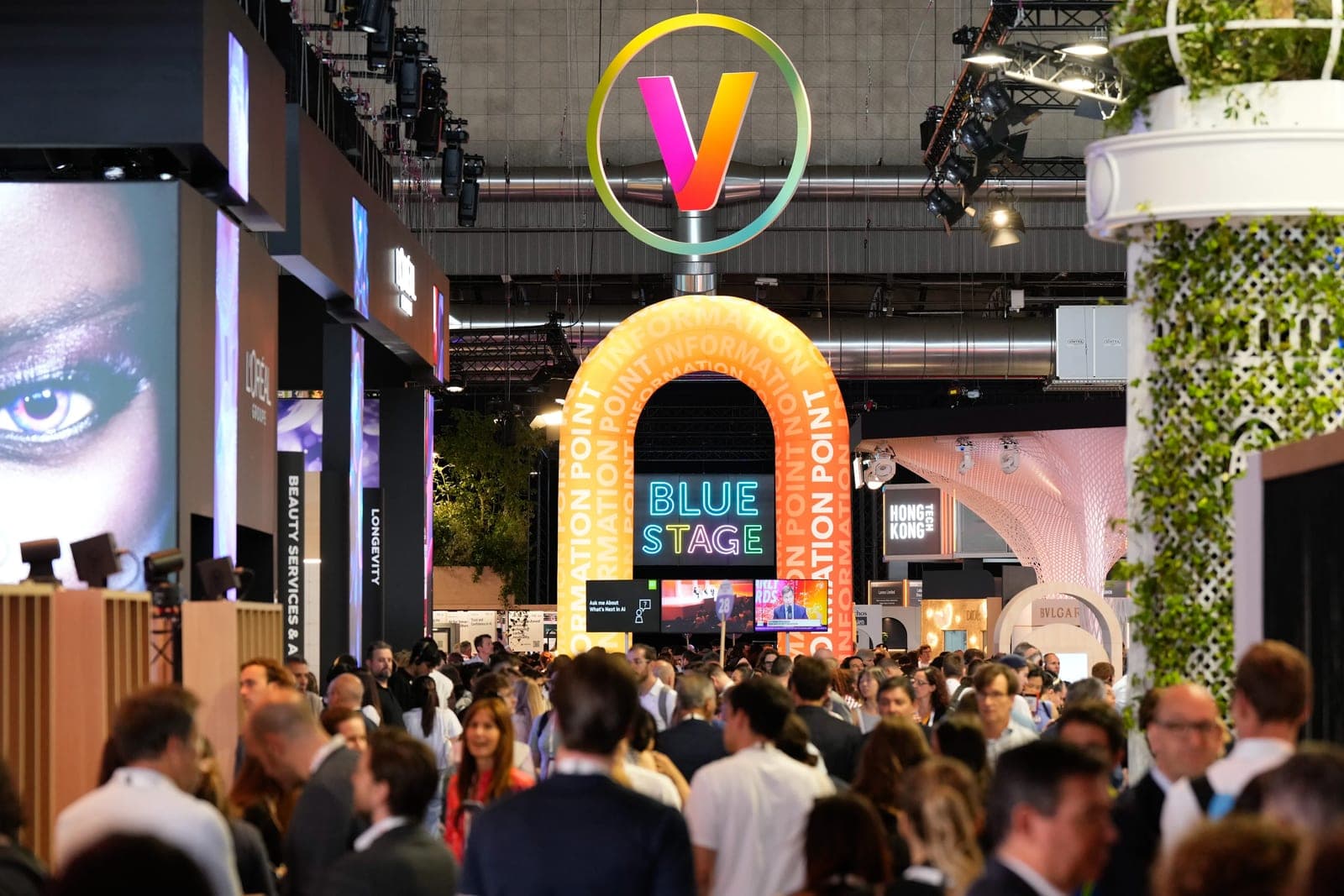 Crowd in the exhibition hall at VivaTech in Paris, under the VivaTech logo and the Blue Stage sign